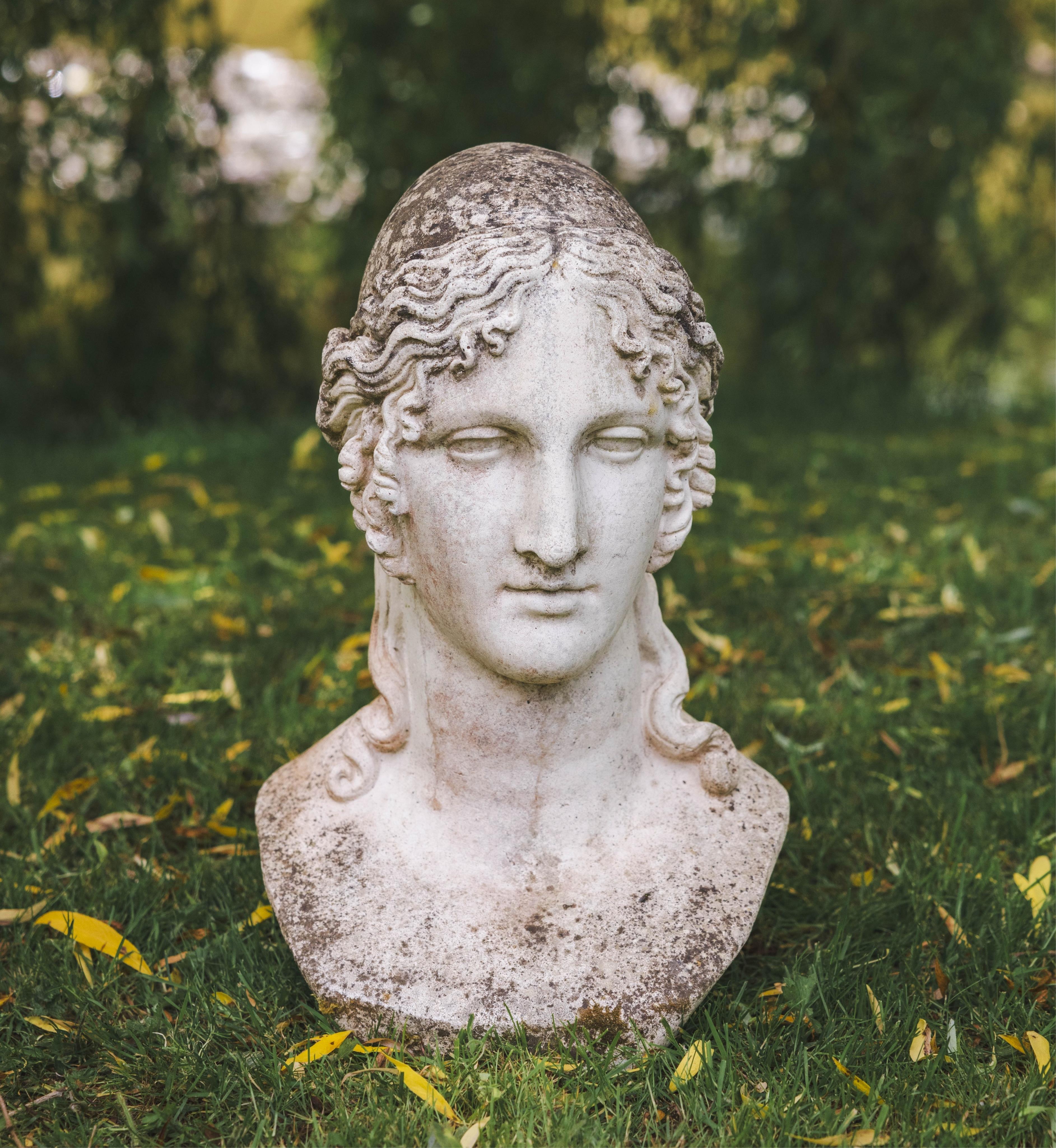 A reconstituted stone classical female bust garden ornament, height 50cm